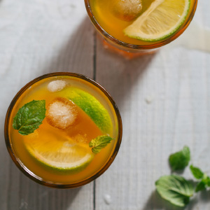 Refreshing drinks with fresh fruit and mint garnishes